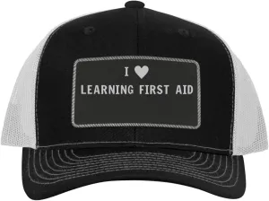 I Heart Love Learning First Aid - Leather Black Patch Engraved Trucker Hat