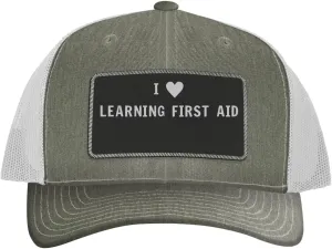 I Heart Love Learning First Aid - Leather Black Patch Engraved Trucker Hat